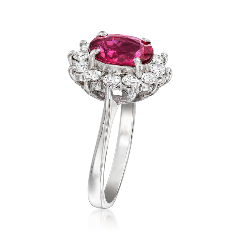 White gold ring with pink oval gemstone and diamond halo, side view with raised setting