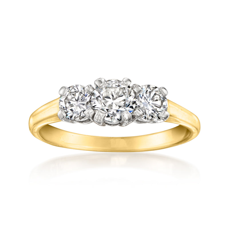 Three-stone diamond ring with oval/round stones in platinum and yellow gold band