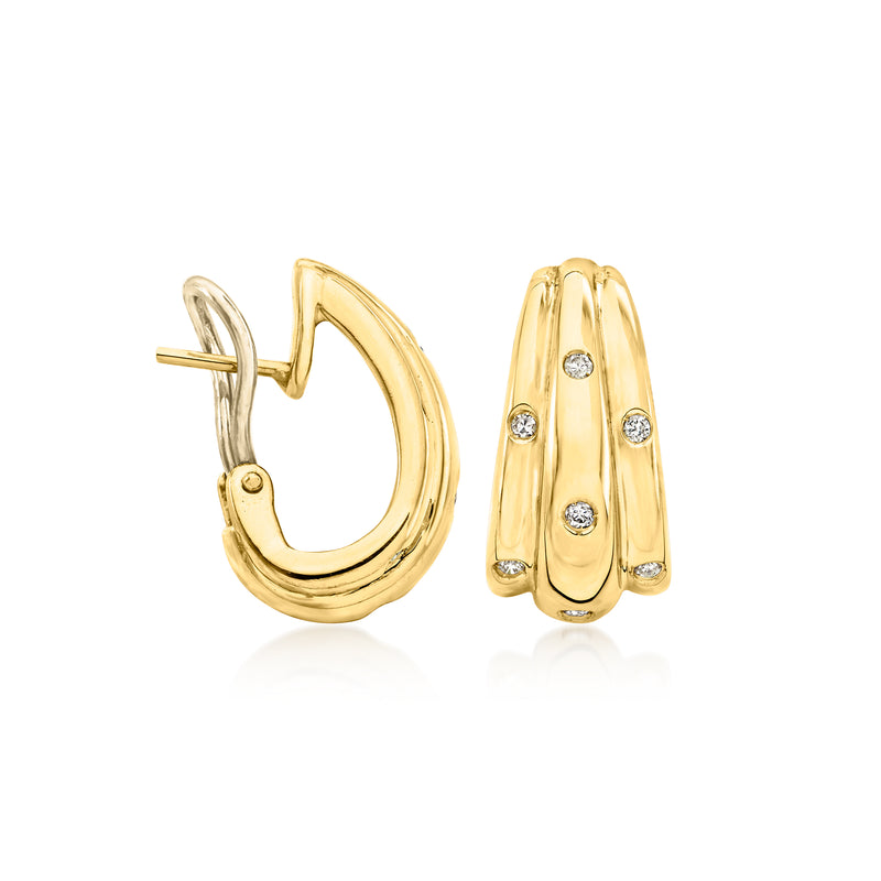 Curved 18kt yellow gold hoop earrings with round diamond accents and post back, side view