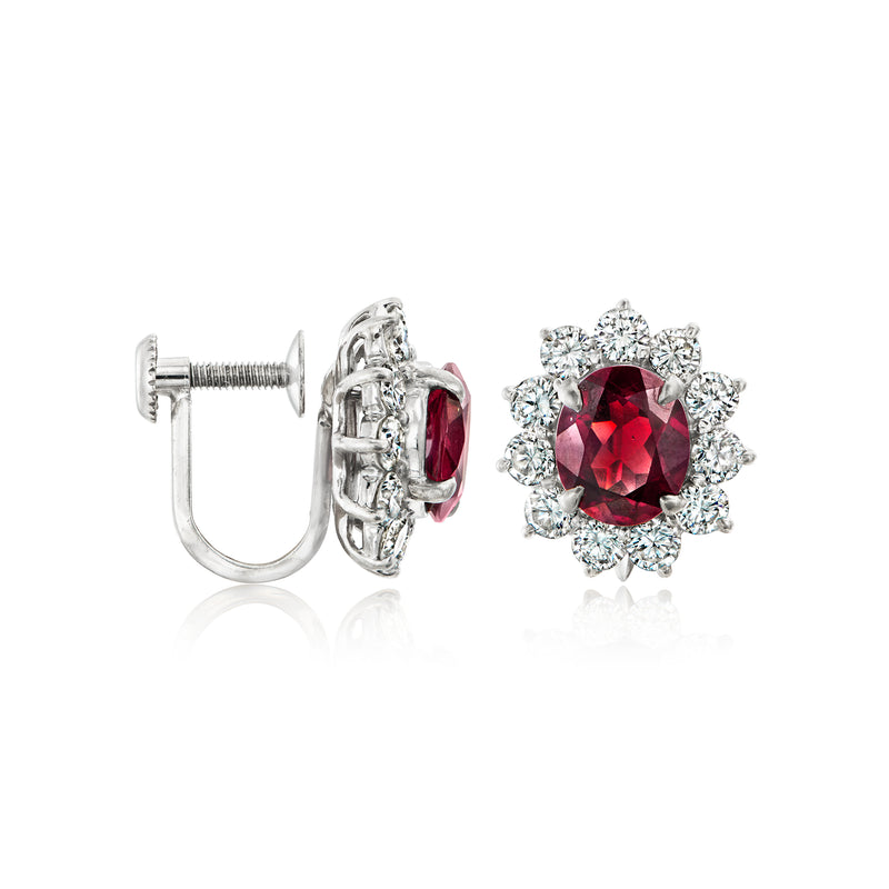 Platinum clip earrings showing hinged clasp; red garnet center with diamond halo flower