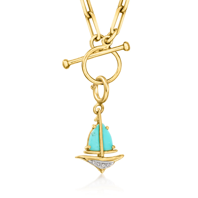 Gold sailboat charm pendant with turquoise sail and small diamond-like accents