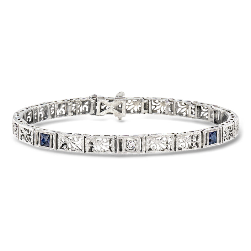 Vintage white gold bracelet with blue synthetic sapphires and one diamond center