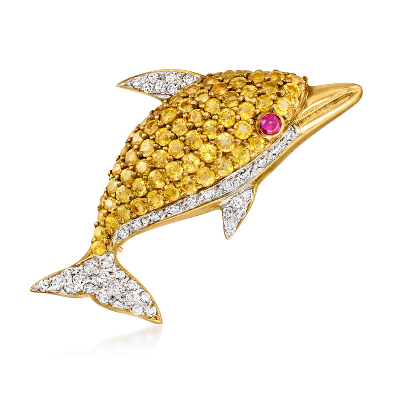 Dolphin lapel pin in 18k yellow gold with ruby eye, yellow sapphires, and diamond accents