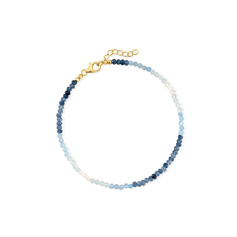 Two-tone blue bead anklet with gold clasp and delicate chain extender