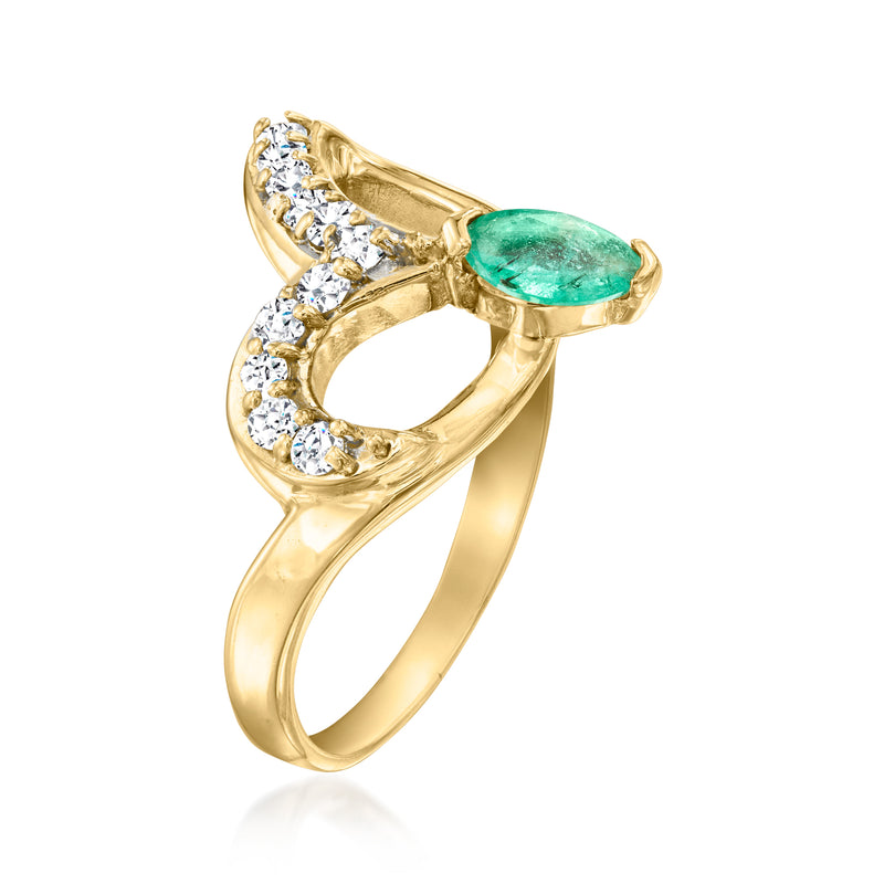 Emerald-green oval center ring in yellow gold with curved diamond band