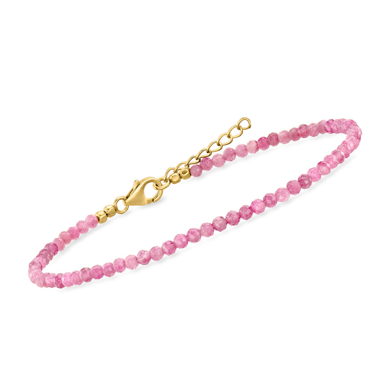 Pink bead anklet with gold-toned chain extender and toggle clasp, beaded strand