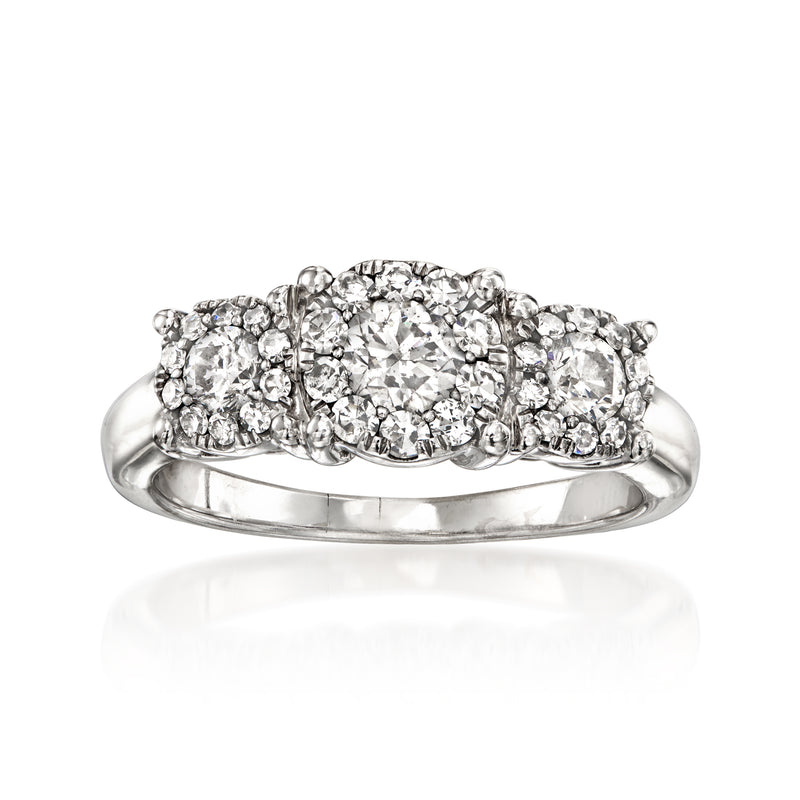 14kt white gold diamond cluster ring with oval center stone and surrounding halos