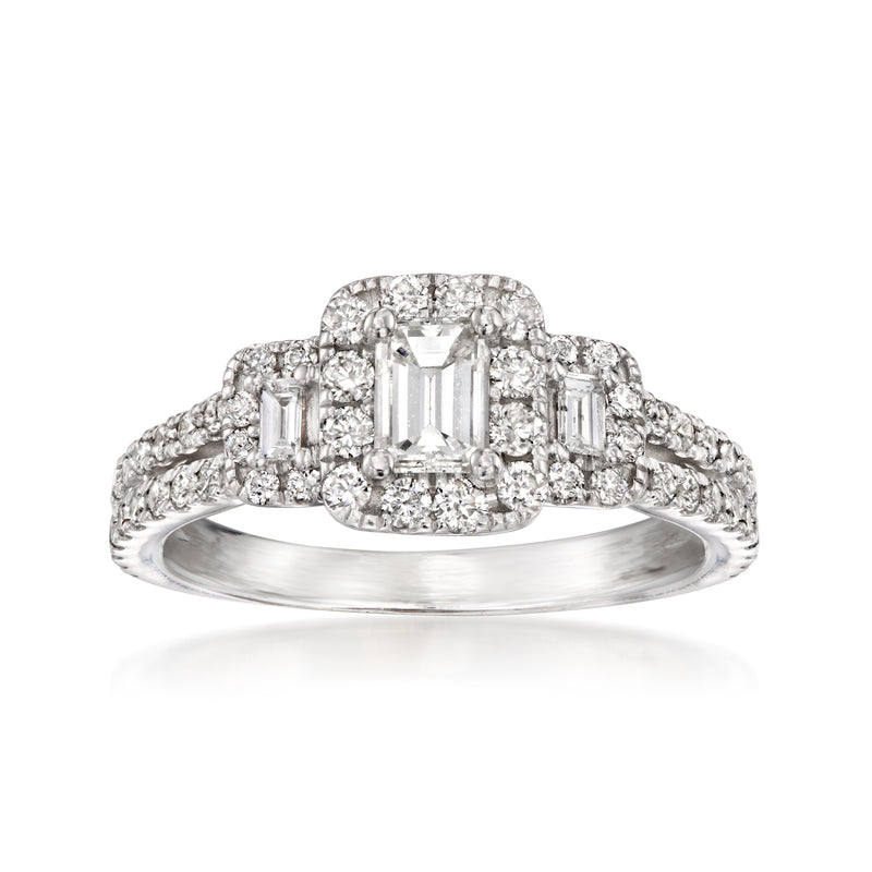 White gold diamond halo ring with central emerald-cut and side baguette diamonds.