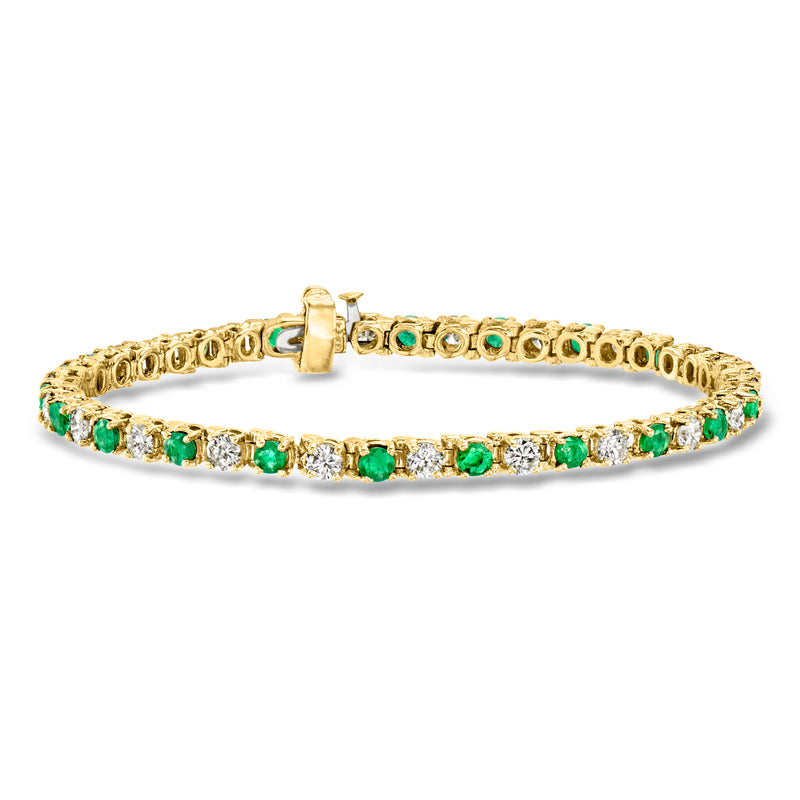 14kt yellow gold tennis bracelet with emerald and diamond accents, hinged clasp