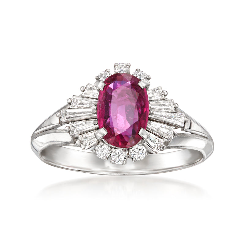 Platinum ring with oval red ruby center and radiant diamond halo and baguette accents