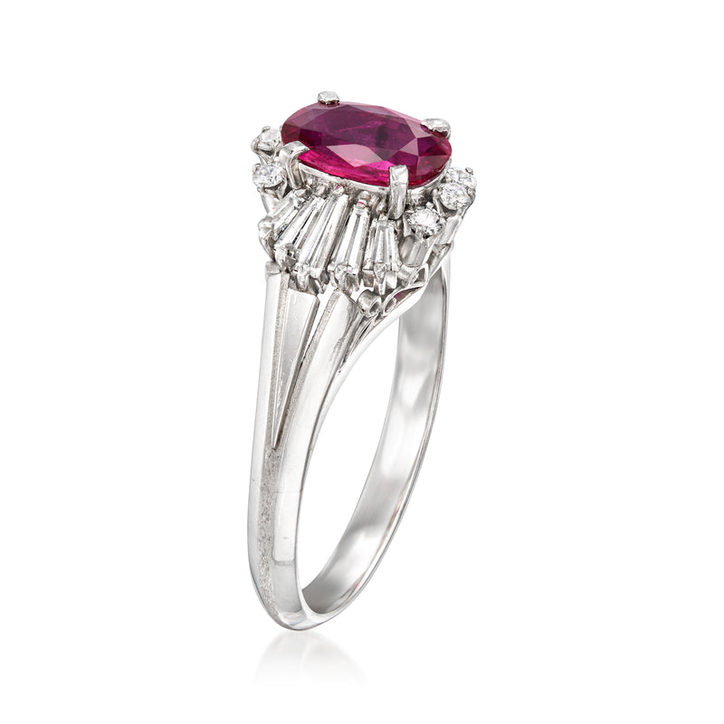 Platinum ruby ring viewed from the side, with baguette diamonds and raised oval center