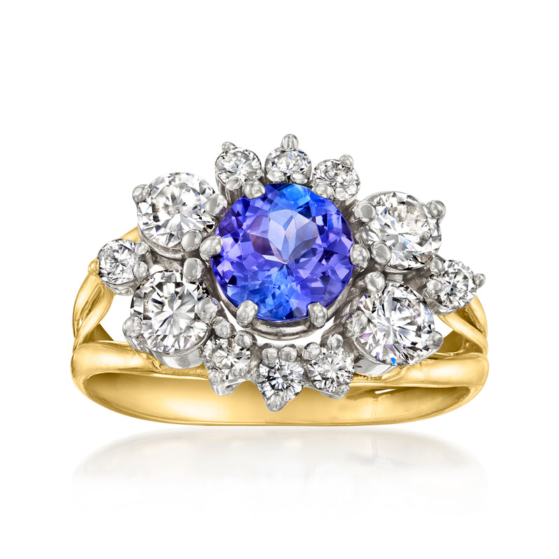 14kt yellow gold ring with oval blue center stone and diamond halo, round side stones