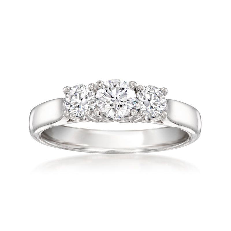 Three-stone diamond ring in polished 14kt white gold, rounded band with prong-set stones