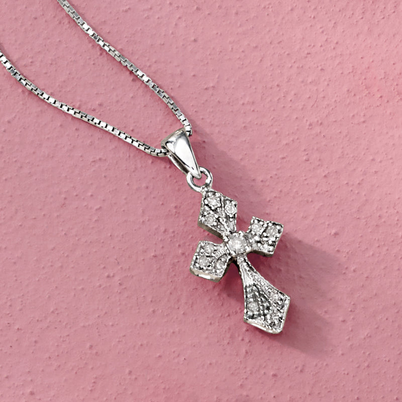 Sterling silver diamond cross pendant close-up on a fine chain