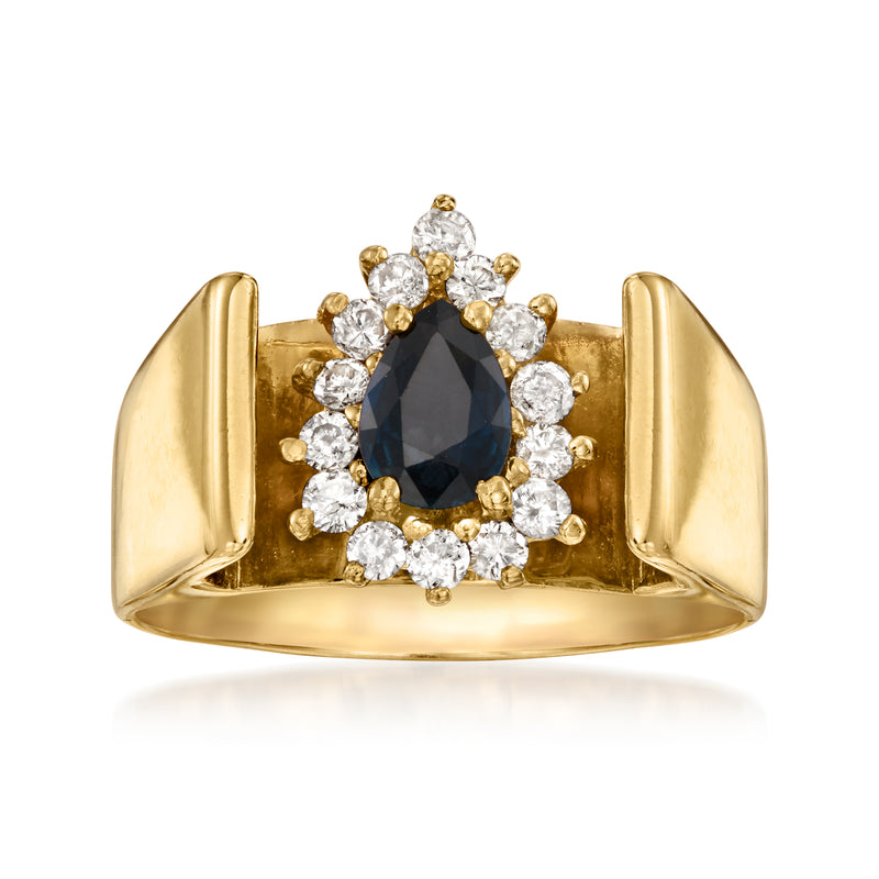 14kt yellow gold vintage ring with oval dark blue sapphire and diamond halo