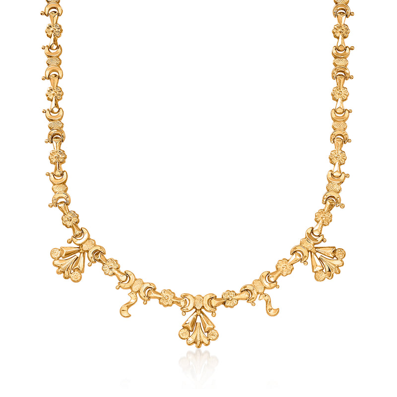 Vintage 18kt yellow gold fancy necklace with ornate linked charms and bow-like drops