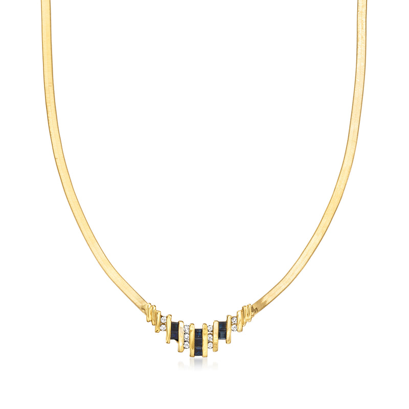 14kt yellow gold necklace with blue sapphire center and small white diamond accents