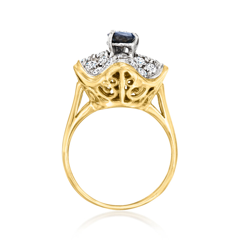 14kt yellow gold ring with prong-set dark blue sapphire and openwork diamond top