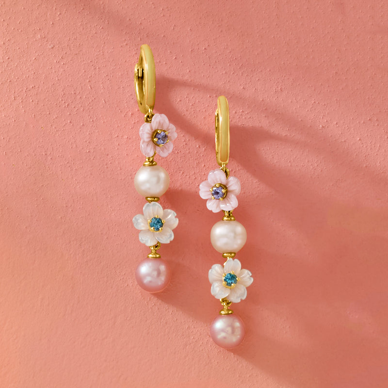 Gold drop earrings with pink floral charms, pearl drops, and blue-green gem centers.