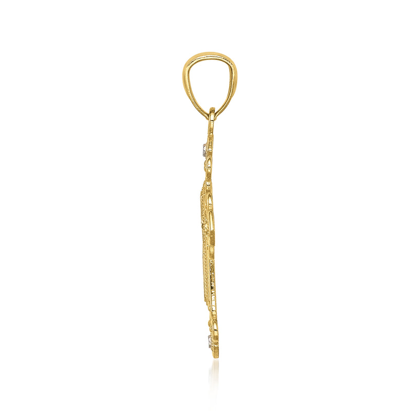 Two-tone gold cross pendant side profile with diamond-cut detailing and bail loop