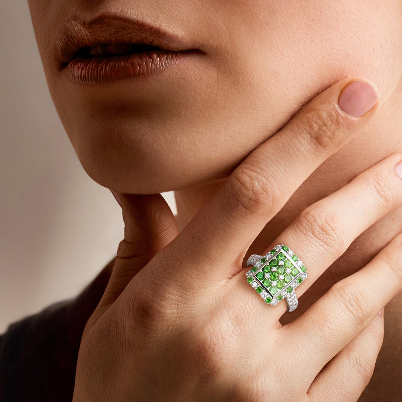 Tsavorite and diamond square ring on hand, platinum band with green center
