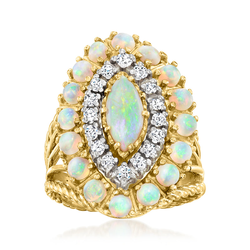Vintage opal and diamond ring in 18kt yellow gold, with oval opal and diamond halo