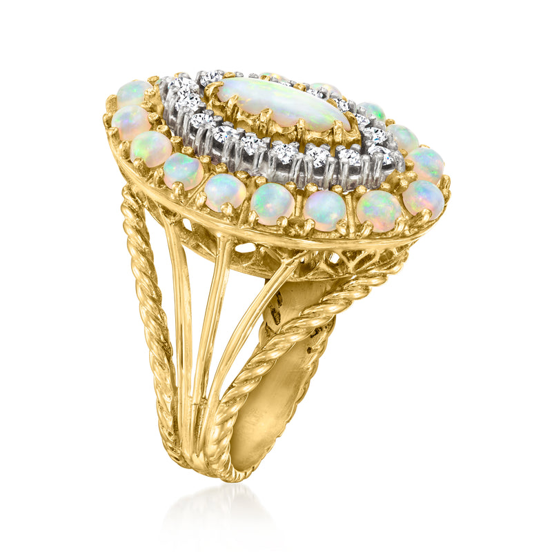 Vintage 18kt yellow gold ring with oval opal center and diamond halo, plus opal accents