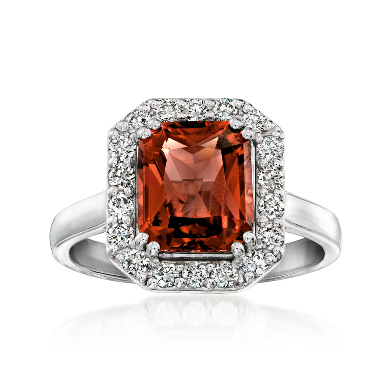 White gold ring with square orange-red gemstone and diamond halo, size 7