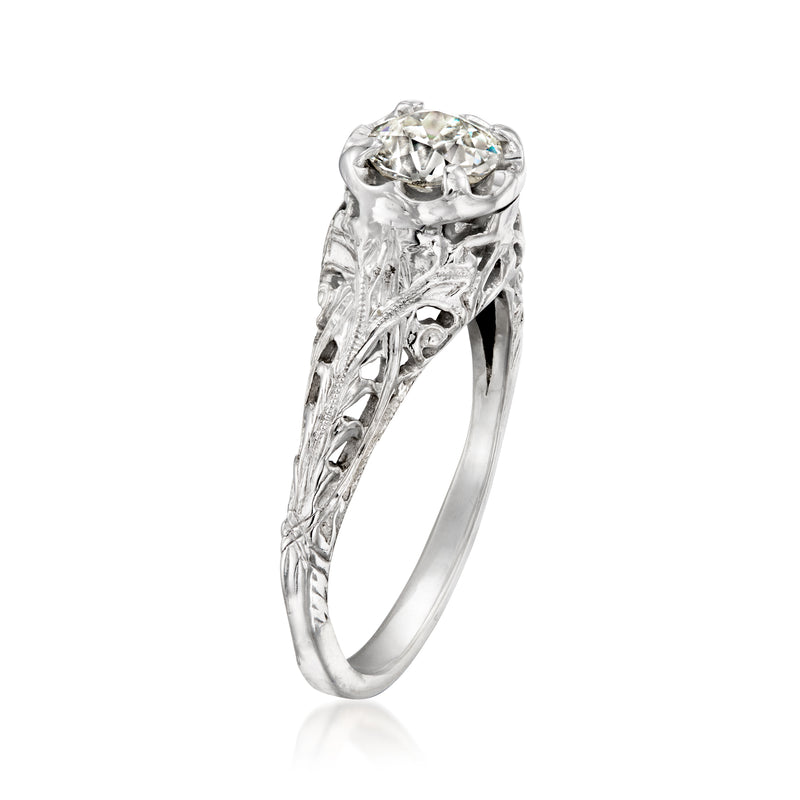 Vintage 14kt white gold diamond ring, side view showing raised round center stone