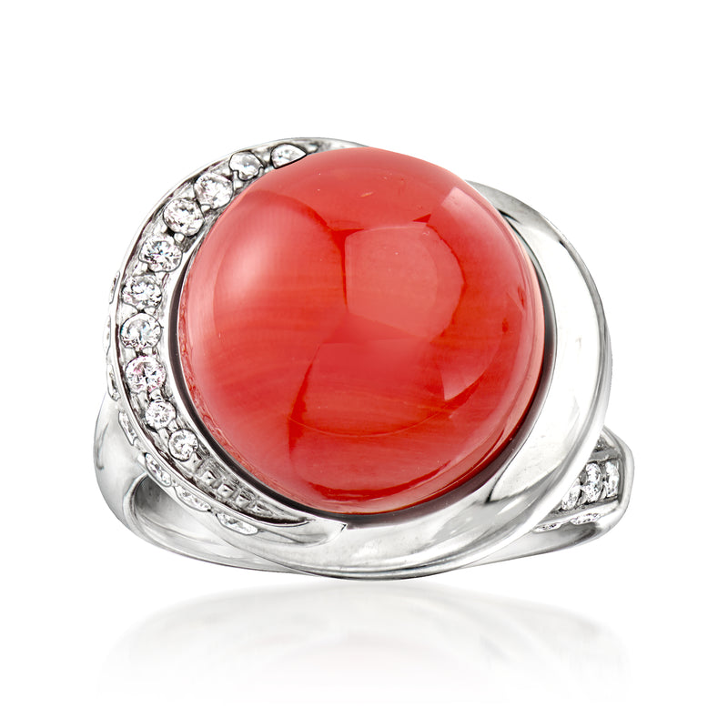 Platinum ring with round coral cabochon and diamond accents