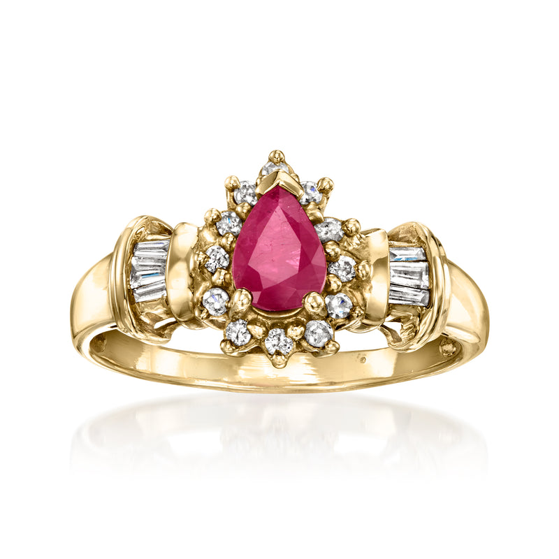 Vintage ruby and diamond halo ring in 14kt yellow gold, pear-cut center, baguette accents
