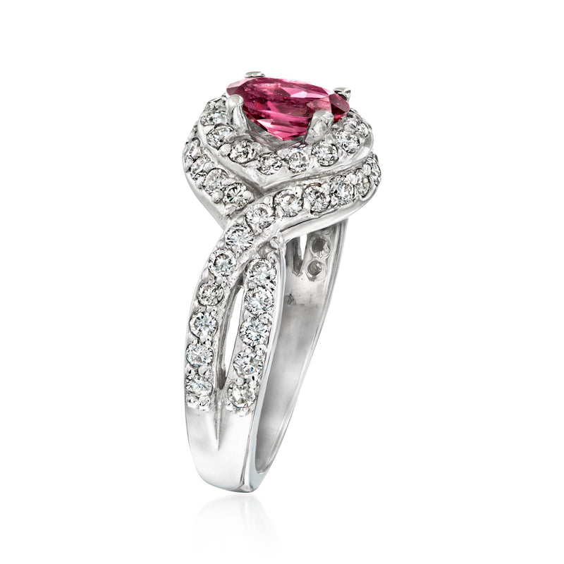White gold ring with oval pink rhodolite center and sparkling diamond pave bands