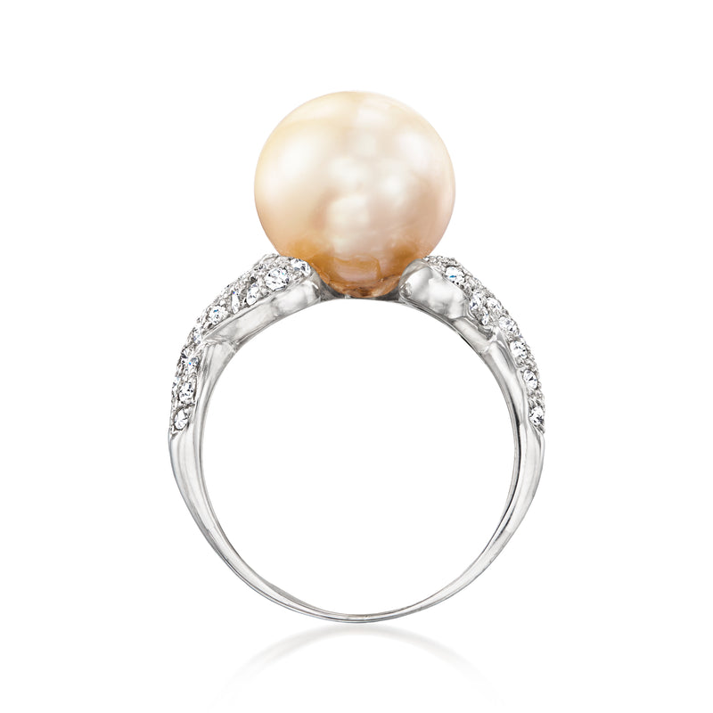 Vintage pearl and diamond ring with open white-gold band and halo of round stones