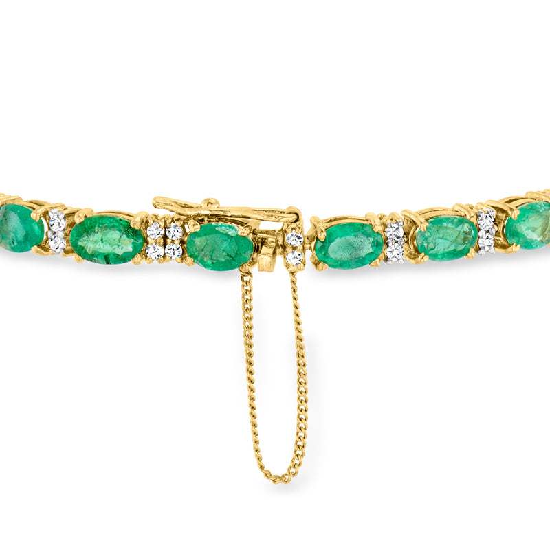 Yellow gold tennis bracelet with emerald green oval stones and white diamond links