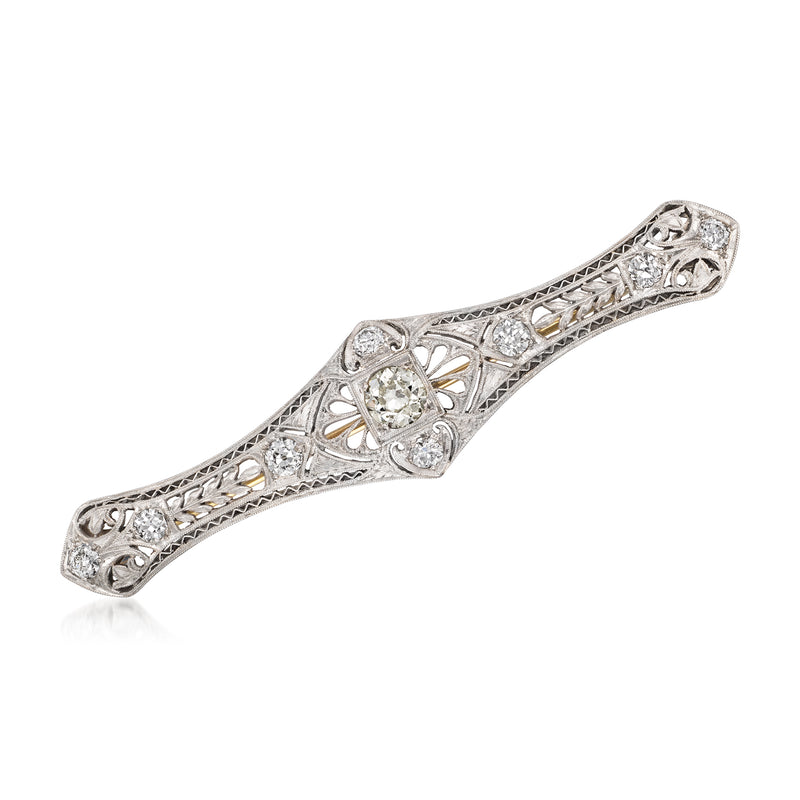 Vintage diamond filigree bar pin in white gold and platinum, with ornate diamond clusters