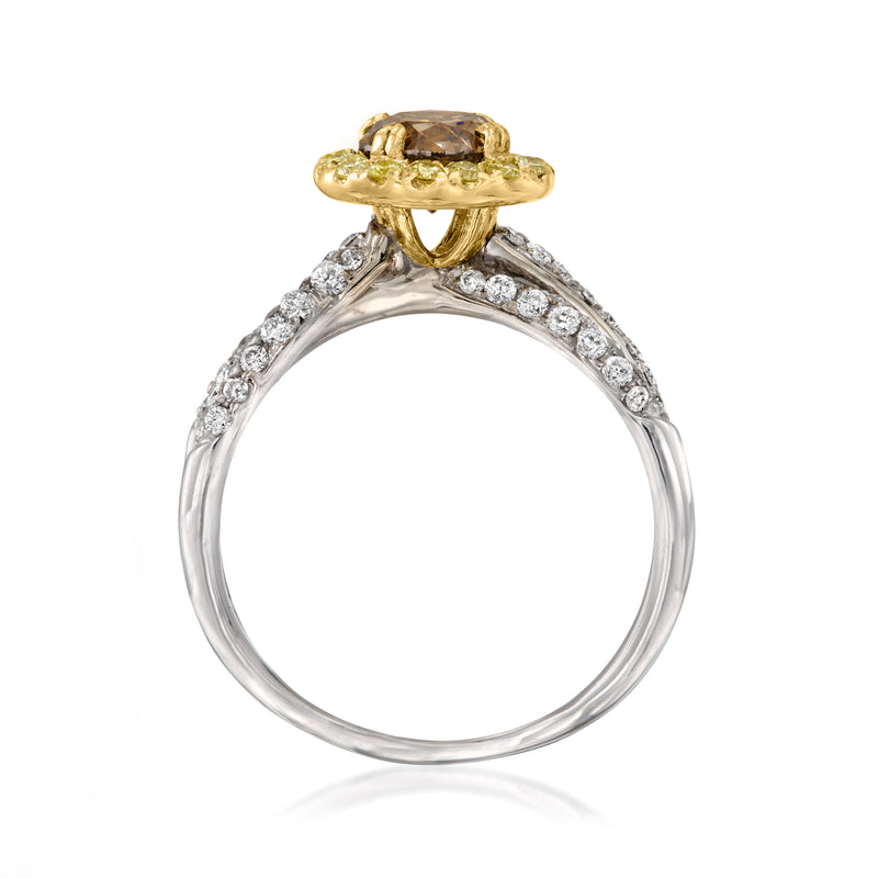 Two-tone gold ring with oval brown center stone, yellow bezel prongs, white diamond halo
