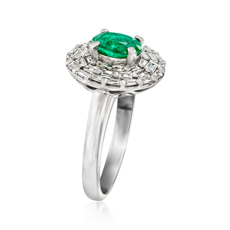 Platinum gemstone ring with oval green emerald and diamond baguette halo, side view