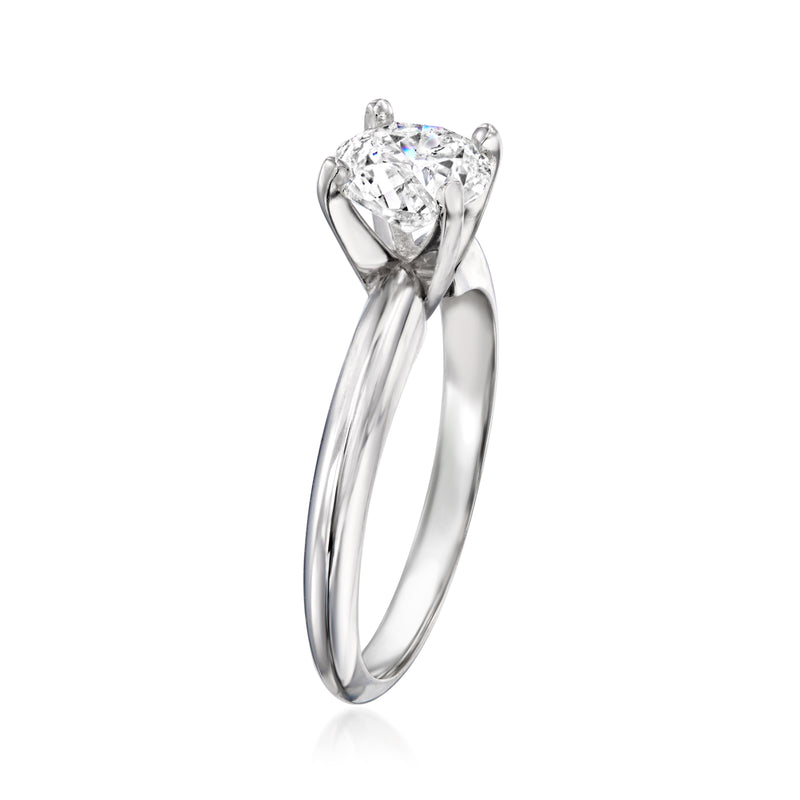 14kt white gold solitaire ring with round diamond in prong setting, side view