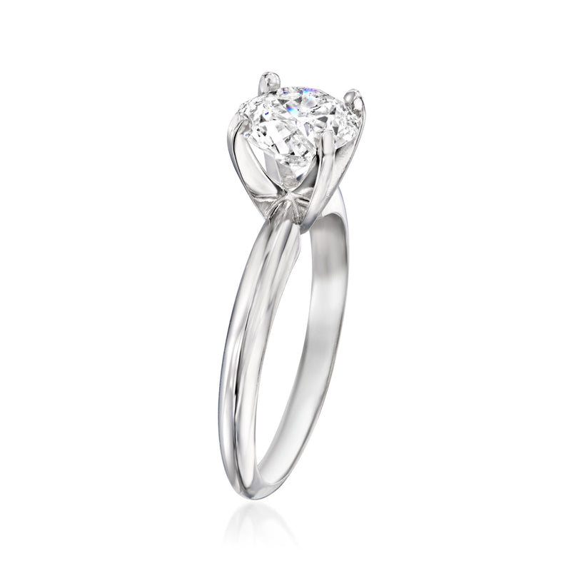14kt white gold solitaire diamond ring, round stone on slender band (side view)