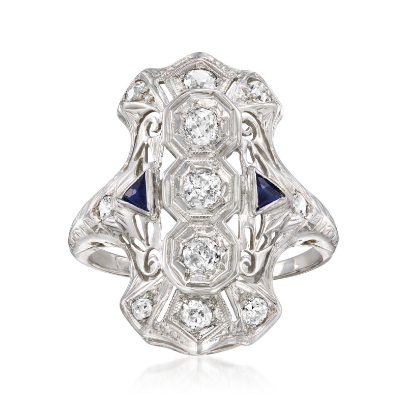 Vintage white gold dinner ring with blue sapphire accents and round diamonds, size 7