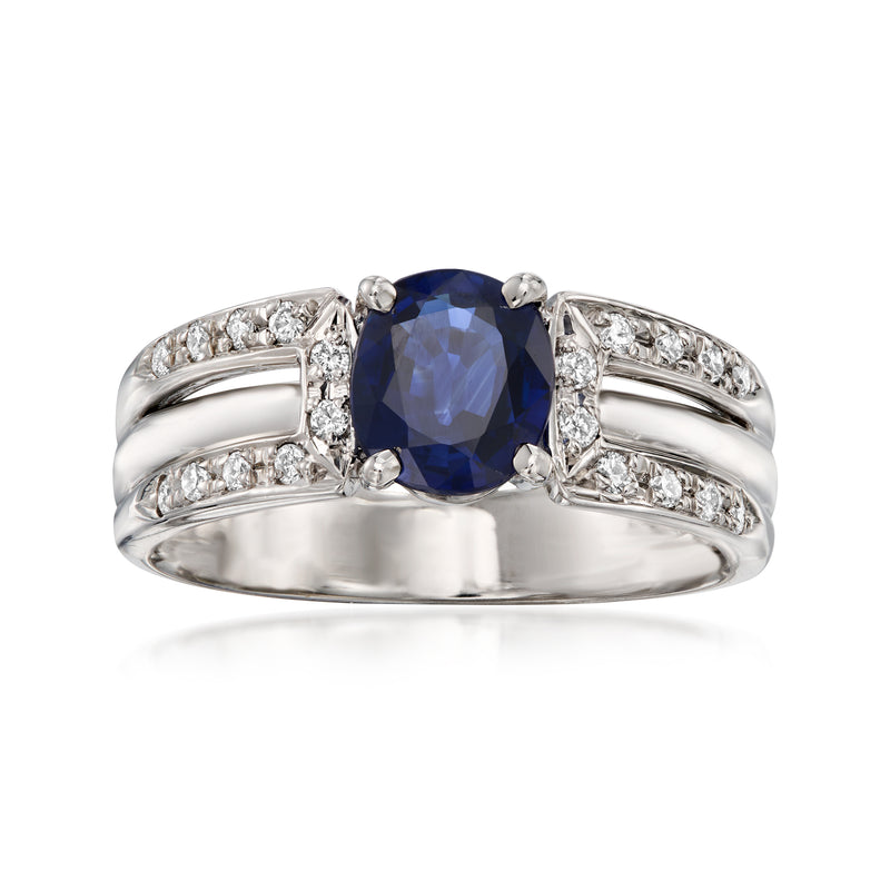 Platinum ring with oval blue sapphire and diamond accents, split gallery design