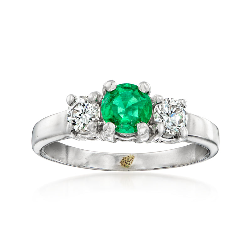 14k white gold emerald and diamond ring with oval green center and round side stones