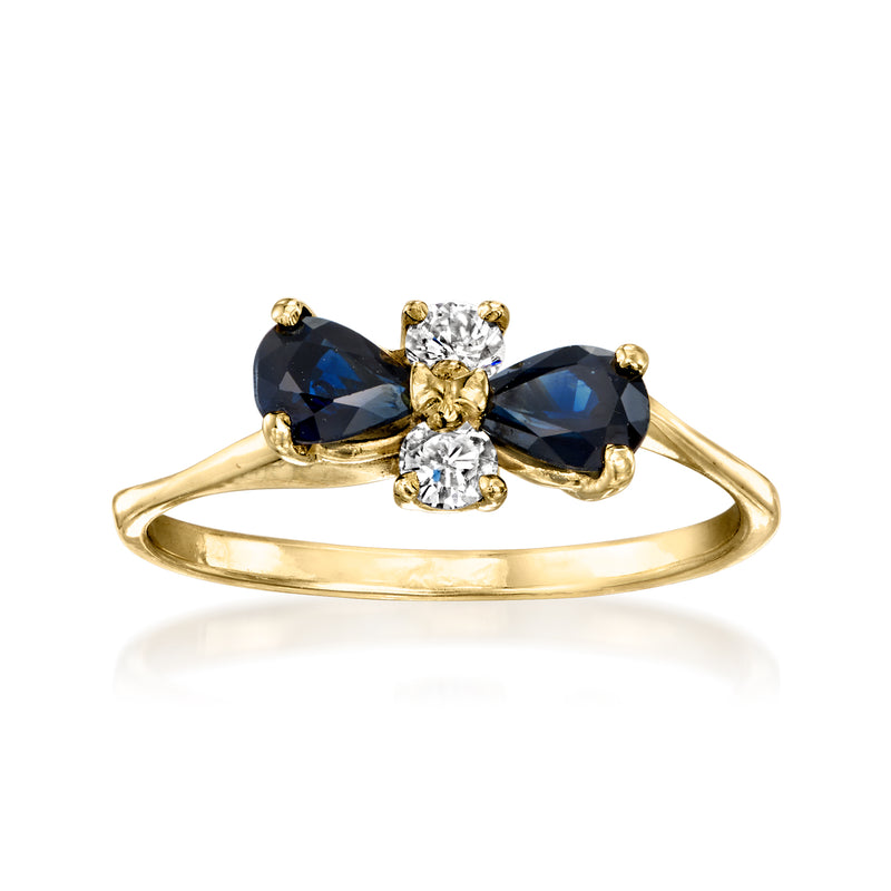 18kt yellow gold ring with dark blue oval sapphires and round diamond accents