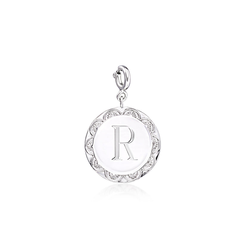 Sterling silver disc charm with engraved letter R, decorative border, hanging loop