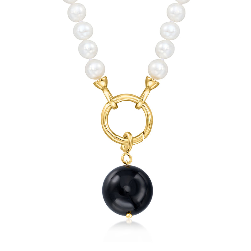 Pearl strand with gold heart-shaped connector and round black onyx bead charm