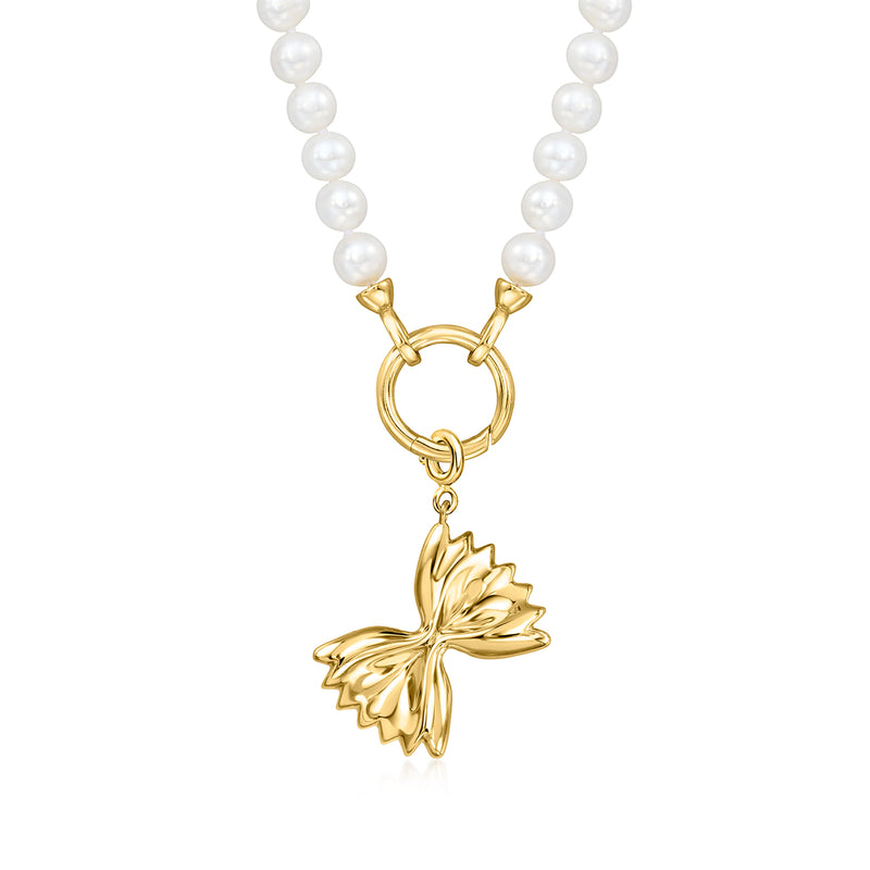 Gold bowtie pasta charm pendant on white pearl necklace, dangling bowtie silhouette
