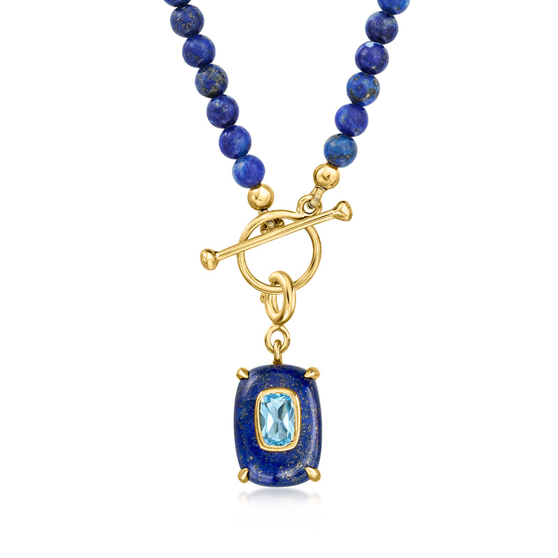 Blue lapis bead necklace with gold crossbar charm and oval sky-blue gemstone