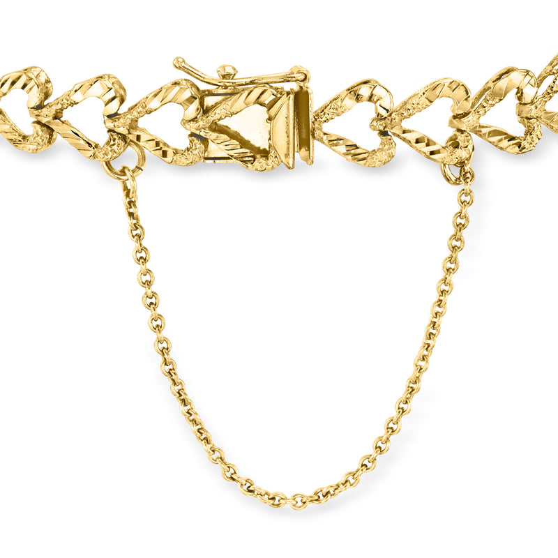 14kt yellow gold heart-link bracelet with clasp, close-up view of chain links.