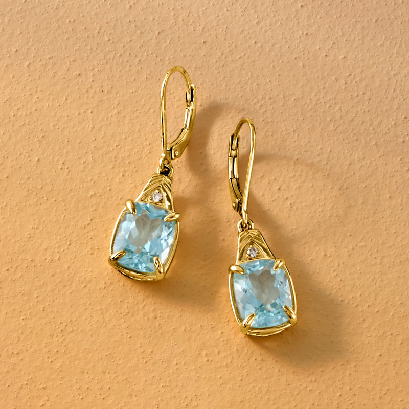 Gold leverback drop earrings with light blue teardrop topaz and diamond trio details