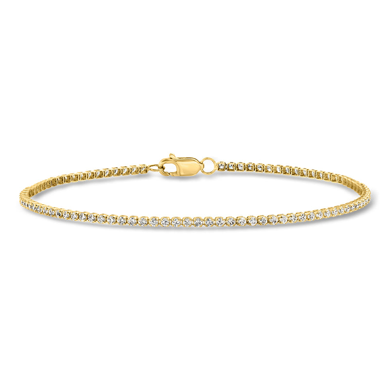 Yellow gold diamond tennis bracelet with box clasp and continuous round stone line.
